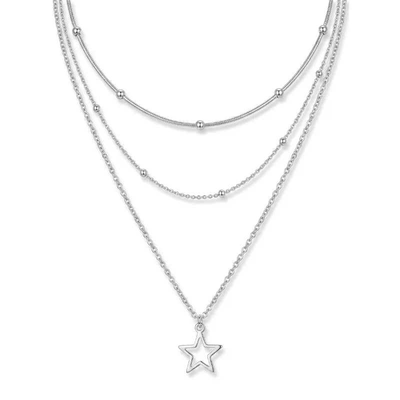 Stela Luxhers – Triple-Layer Silver Necklace flat lay